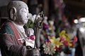 Buddha statue with a donation in one of Fukuoka temples, Japan, East Asia