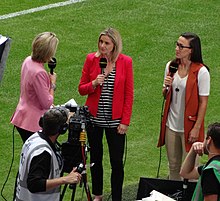 Bronze (right) and Kelly Smith (centre) providing pitchside punditry for a Chelsea vs Notts County match in 2015 Chelsea Ladies 1 Notts County Ladies 0 (19588385163) (2) (cropped).jpg