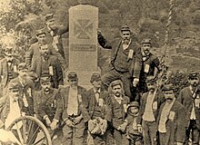 Col. Joseph Hill Sinex (center, hand on monument) with former members of the 91st Pennsylvania at the regiment's new monument at the highest point on Little Round Top, Gettysburg National Military Park, c. 1889. Col. Joseph Synex with 91st Pennsylvania Infantrymen, Little Round Top, Gettysburg, c. 1889.jpg