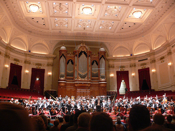 The orchestra performing in the Grote Zaal (Great Hall)