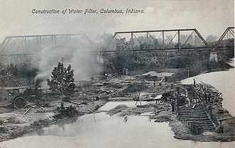 Construction of the 1903 water filter in Columbus, Indiana with the Second Street Bridge visible in the background Construction of the water filter in Columbus, Indiana.jpg