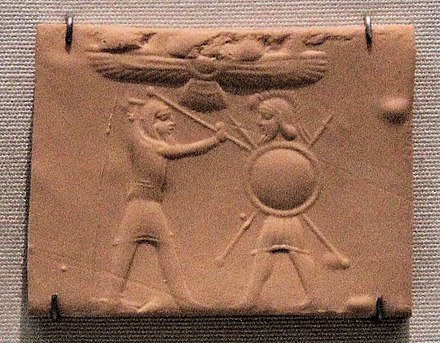 Cylinder seal, chalcedony; depicts a Median warrior, on the left, facing a Greek warrior, with hoplite equipment, stabbing him with a lance; above, a winged solar disk. Achaemenid period, 6th-4th century BC. British Museum BM 89333.[46]