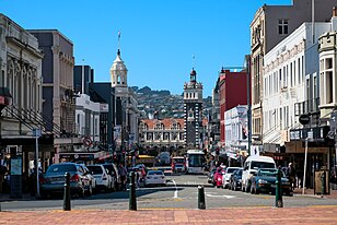 Dunedin railway station as seen from the Octagon. The station forms a terminating vista for Lower Stuart Street. Dunedin train station terminating vista.jpg