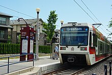 An eastbound train at the station Eastbound train at Quatama Station - Hillsboro, Oregon.JPG