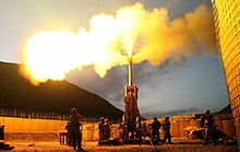 M777 of Battery C, 1st Battalion, 321st Airborne Field Artillery Regiment firing at Forward Operating Base Bostick, Afghanistan, 2009. Firing rounds with an M777 Howitzer Afghanistan 2009.jpg