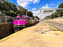 An outbound Needham Line train arriving at Forest Hills on Track 5 in 2023 Forest Hills MBTA Commuter Rail Platform, August 2023.jpg