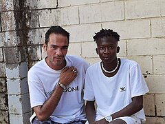 Gambian boy with Dr. Ebrima N. Badjie a famous freedom fighter and youth activist in the Gambia.jpg