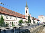 Elisabethine monastery and old hospital wing with walls and small monuments