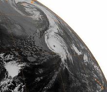 Hurricane John at its tertiary peak strength in the far north-central Pacific Ocean. There is also an extratropical cyclone north of John. Hurricane John Tertiary Peak.jpg