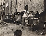 Huts and unemployed, West Houston and Mercer St., Manhattan