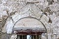 English: Consecration stone over the church entrance Deutsch: Weihestein an der Kirchenruine