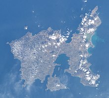 The Greek island of Lemnos, on which the island of Altis is based. Its in-game rendition was also originally named Lemnos, but it was renamed as a result of the arrests. Limnos from space (cropped).jpg