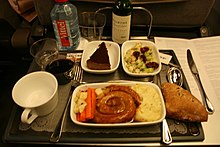 A Lincolnshire sausage, manufactured in the unlinked style more commonly associated with the Cumberland sausage Lincolnshire sausage dinner.jpg