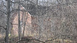 Long Schoolhouse through the trees.jpg