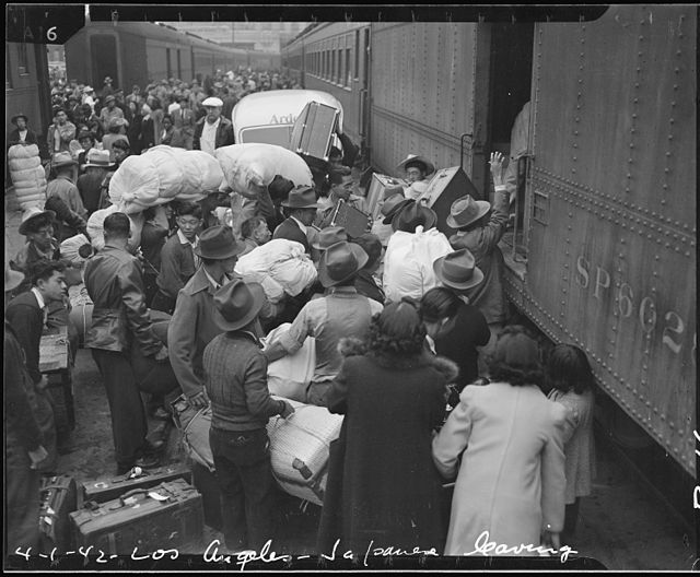 Families of Japanese ancestry being removed from Los Angeles during World War II