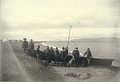 Men standing on the beach with umiak, or skin boat, Teller, Alaska, ca 1900 (HESTER 321).jpeg