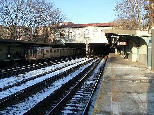 A 5 train enters the Morris Park station in the Bronx on the IRT Dyre Avenue Line