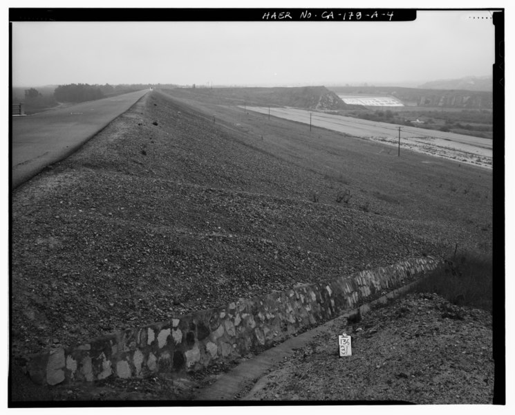 File:OVERVIEW TO EAST, FROM WEST END OF EARTHEN EMBANKMENT, SHOWING DOWNSTREAM FACE OF DAM, AND SPILLWAY FACE IN DISTANCE AT UPPER RIGHT. - Prado Dam, Embankment, Santa Ana River HAER CAL,33-CORO.V,1A-4.tif
