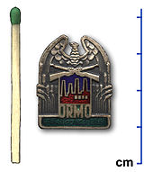 Inconspicuous button of the ORMO member to be worn on a front pocket or lapel (later years) Odznaka ORMO (2).jpg