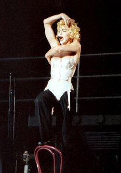 "Open Your Heart" was Madonna's fifth number-one in the Billboard Hot 100. In the image, the singer is performing the track on 1990's Blond Ambition W