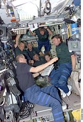 STS-112 crew receives a safety briefing from Station Commander Korzun