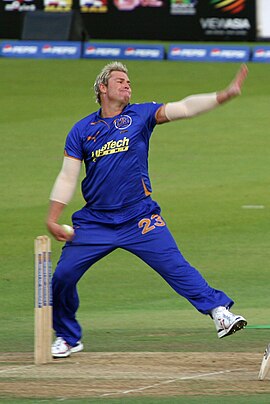 Shane Warne bowling a leg spin delivery Shane Warne bowling 2009.jpg