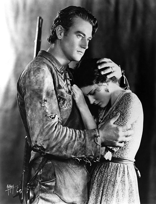 With Marguerite Churchill in the widescreen The Big Trail (1930); John Wayne's first role as a leading man