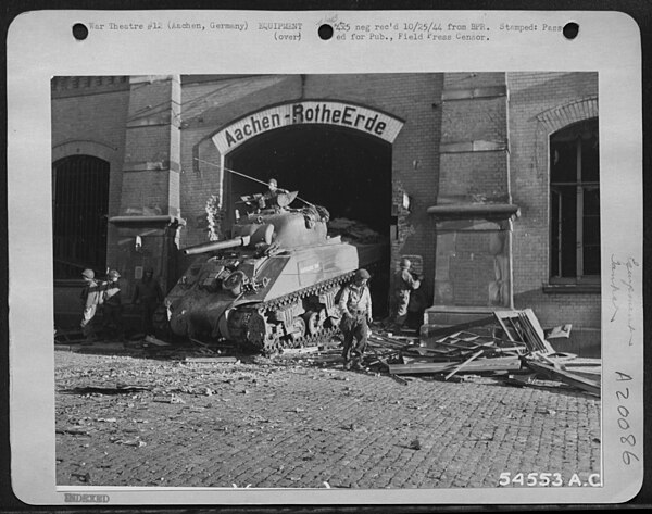 The first U.S. tank to enter Aachen, Germany. Photo from battle of Aachen, 1944.