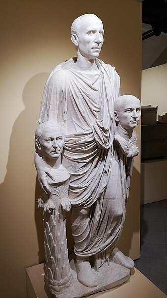 The so-called "Togatus Barberini" depicting a Roman senator with portrait busts of ancestors, one of which is supported by a herma: marble, late 1st c