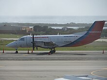 A former Transcarga Embraer EMB 120 Brasilia parked at Queen Beatrix International Airport in 2013 Transcarga E120F at AUA.JPG