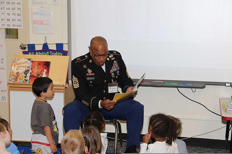 File:U.S. Army Command Sgt. Maj. Shelton R. Williamson, left, the senior enlisted adviser for the 10th Regional Support Group, reads the book, "The Amazing Turkey Rescue," to kindergarten students during support 131120-A-LG030-584.jpg