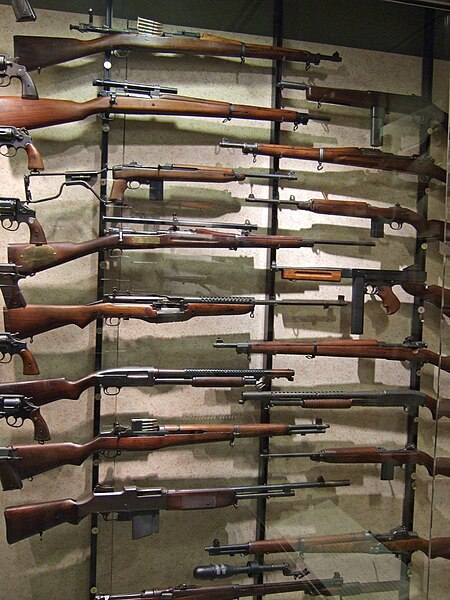 Various long guns used by the United States military during World War II, including rifles, carbines, submachine guns, and shotguns. In contrast, part