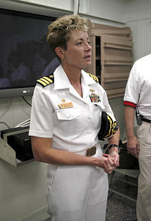 US Navy 030606-N-6669N-004 Cmdr. Ann Clair Phillips addresses guests and media aboard the Pre-commissioning Unit (PCU) Mustin (DDG 89) berthed at the Allegheny Pier on Naval Air Station (NAS) Pensacola.jpg