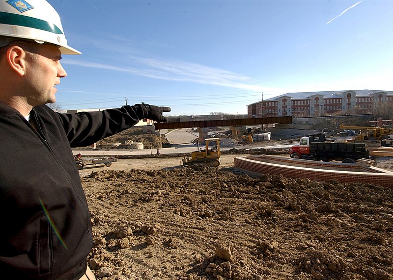 File:US Navy 031202-N-5576W-002 Lt. Dan Cook, deputy resident officer in charge of construction for Camp John Paul Jones at the Recruit Training Command (RTC) Great Lakes, explains the progress of construction.jpg