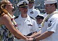 US Navy Engineman 2nd Class Anthony Bartelli (right) holds an