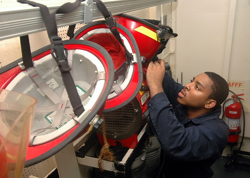 File:US Navy 070824-N-0998G-019 Damage Controlman Fireman Apprentice Alfred Patton, a native of Los Angeles, organizes firefighting helmets after a fire drill aboard USS Bonhomme Richard (LHD 6).jpg