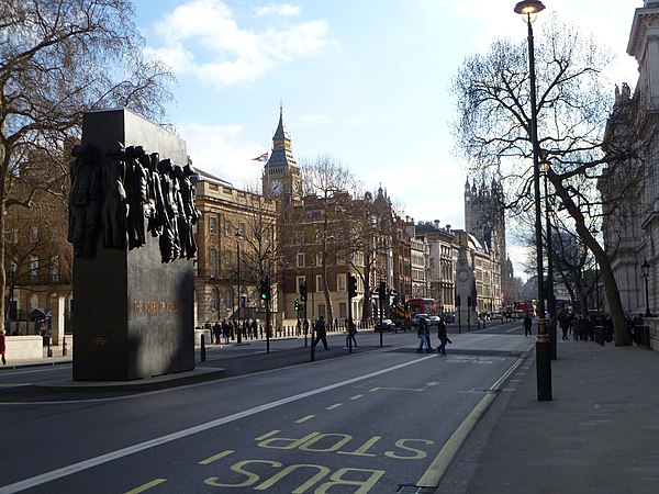 Whitehall pictured in 2012, with The Cenotaph and Monument to the Women of World War II in the middle of the carriageway, and the Elizabeth Tower hous