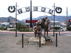 Entrance sign and sculpture of a mule driver