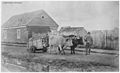 "This was the era of oxen which Farragut housed in the stables, Bldg. 88. One of the workmen is shown here bringing... - NARA - 296880.jpg
