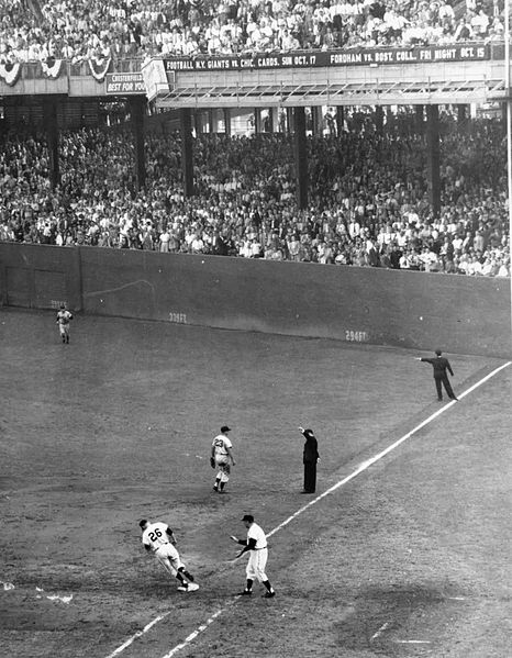 Dusty Rhodes rounds first base after hitting a home run during the 7th inning