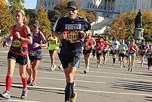 With over 30,000 participants, the annual Marine Corps Marathon, held annually in October, is the largest non-prize money marathon in the country. 2014 Marine Corps Marathon in front of US Botoanic Garden.jpg