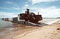 A forklift picks up CONEX containers from a causeway to transport them ashore for use during the joint Thai-US combined exercise THALAY THAI '89 - DPLA - aedd72c9338e763c1865b593de2214a8.jpeg