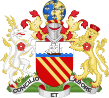 Gules, three bendlets enhanced Or; a chief argent, thereon on waves of the sea a ship under sail proper. On a wreath of colours, a terrestrial globe semée of bees volant, all proper. On the dexter side a heraldic antelope argent, attired, and chain reflexed over the back Or, and on the sinister side a lion guardant Or, murally crowned Gules; each charged on the shoulder with a rose of the last. Motto: "Concilio et Labore".