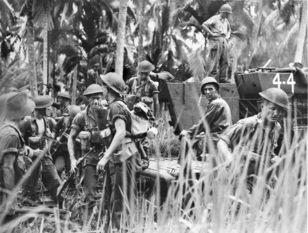 Troops from the Australian 2/32nd Battalion land at Weston aboard US-crewed landing vehicles