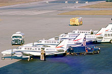 A line of Britt Air Beech 99 aircraft Beech -99 N316VA AlCtr Britt ORD 21.10.75 edited-2.jpg