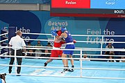 Deutsch: Boxen bei den Olympischen Jugendspielen 2018 Tag 12, 18. Oktober 2018 - Kampf um Bronze im Leichten Schwergewicht Jungen – Karol Itauma (Großbritannien, blau) schlägt Ruslan Kolesnikov (Russland, rot) 4-1; Ringrichter ist Alejandro Barrientos (Kuba). English: Boxing at the 2018 Summer Youth Olympics on 18 October 2018 – Gold Medail Match light heavyweight Boys - Karol Itauma (Great Britain, blue) beats Ruslan Kolesnikov (Russia, red) 4-1; Referee is Alejandro Barrientos (Cuba). Español: Boxeo en los Juegos Olímpicos Juveniles de Verano de 2018 en 18 de octubre de 2018 - Medalla de oro de los hombres de peso pesado ligero: Karol Itauma (Gran Bretaña, azul) vence a Ruslan Kolesnikov (Rusia, rojo) 4-1; El árbitro es Alejandro Barrientos (Cuba).