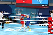 Deutsch: Boxen bei den Olympischen Jugendspielen 2018 Tag 12, 18. Oktober 2018 - Finale im Leichten Weltergewicht Jungen – Ilia Popov (Russland, rot) schlägt Talgat Shaiken (Kasachstan, blau) 4-1; Ringrichter ist James Beckles (Trinidad und Tobago). English: Boxing at the 2018 Summer Youth Olympics on 18 October 2018 – Final Light Welterweight Boys Bout - Ilia Popov (Rusia, rojo) supera a Talgat Shaiken (Kazajstán, azul) 4-1; Referee is James Beckles (Trinidad and Tobago). Español: Boxeo en los Juegos Olímpicos Juveniles de Verano de 2018 en 18 de octubre de 2018 - Chicos de peso welter ligero final: Ilia Popov (Uzbekistán, roja) le gana a Talgat Shaiken (Egipto, azul) 4-1; El árbitro es James Beckles (Trinidad y Tobago).