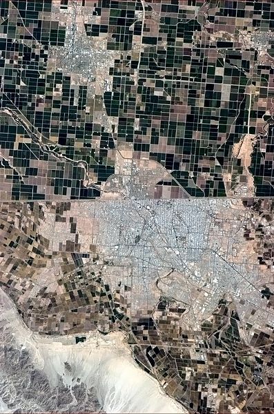 Calexico, seen from the International Space Station, is situated north of the Mexico–US border.