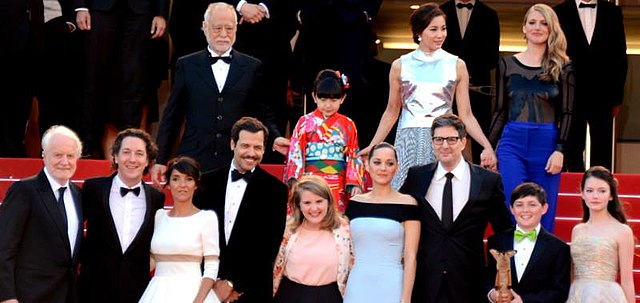 The film's crew at the Cannes Film Festival: (from bottom right) Mackenzie Foy, Riley Osborne, Mark Osborne, Marion Cotillard and other actors who pro