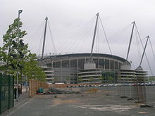 Empty land surrounding the stadium has been envisaged for development since 2002. City of Manchester Stadium collar site.jpg